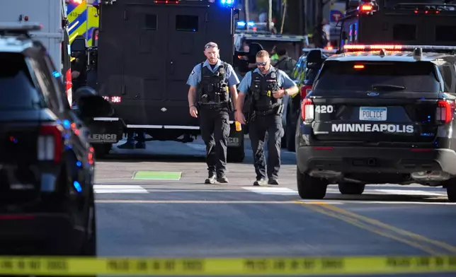 Police respond to a shooting Wednesday, Sept. 2, 2026, in downtown Minneapolis. (AP Photo/Ellen Schmidt)