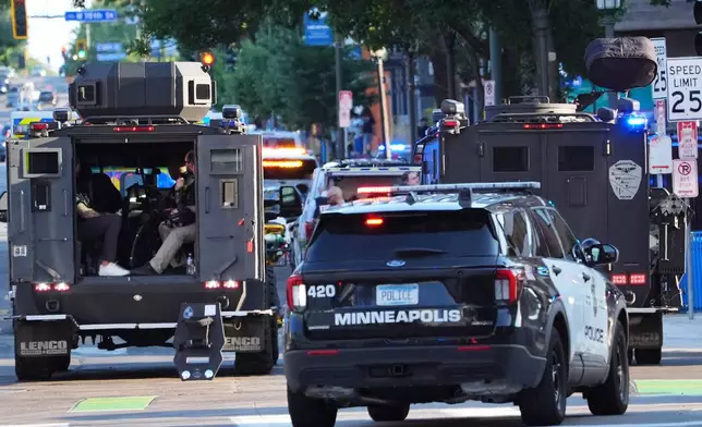 Law enforcement respond to a shooting Wednesday, Sept. 2, 2026, in downtown Minneapolis. (AP Photo/Ellen Schmidt)