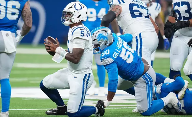 Indianapolis Colts quarterback Anthony Richardson Sr. (5) is sacked by Detroit Lions defensive lineman Skyler Gill-Howard (50) during the first half of a preseason NFL football game in Indianapolis, Saturday, Aug. 29, 2026. (AP Photo/Jeff Roberson)