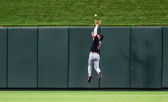 Washington Nationals' Dylan Crews catches a fly ball for an out against St. Louis Cardinals' Jordan Walker during the third inning of a baseball game Saturday, Sept. 19, 2026, in St. Louis. (AP Photo/Scott Kane)