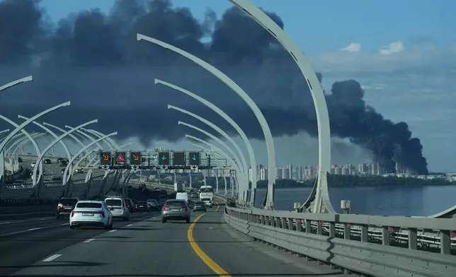 FILE - A plume of black smoke is seen over St. Petersburg, Russia, Wednesday, June 3, 2026, after a Ukrainian drone attack. (AP Photo, File)