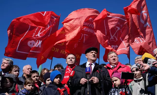 FILE - Russian Communist Party leader Gennady Zyuganov, center, speaks to journalists after laying flowers at the mausoleum of USSR founder Vladimir Lenin in Red Square, in Moscow, marking the 156th anniversary of his birth on Wednesday, April 22, 2026. (AP Photo/Pavel Bednyakov, File)