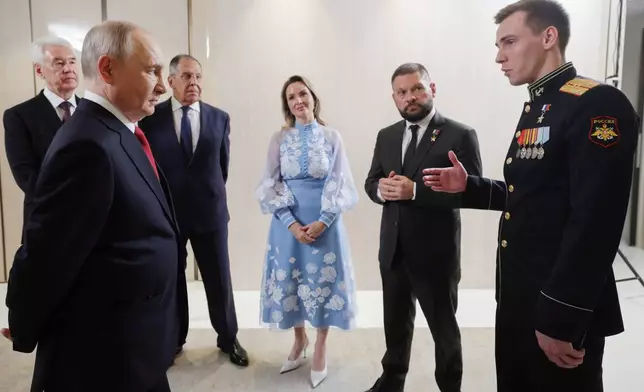 FILE - Russian President Vladimir Putin, foreground left, meets with United Russia party leaders, from left, Moscow Mayor Sergei Sobyanin; Putin; Foreign Minister Sergey Lavrov, background second right, Presidential Commissioner for Children's Rights Maria Lvova-Belova, center; war correspondent and Hero of Russia Yevgeny Poddubny, second right; and Chief of the Yunarmiya main headquarters Vladislav Golovin, in Moscow, on Saturday, Sept. 5, 2026. (Gavriil Grigorov/Sputnik, Kremlin Pool Photo via AP, File)