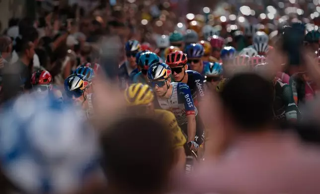 Cyclists ride during the 21st stage of the Spanish Vuelta cycling race, from Carrefour Granada to Granada, Spain, Sunday, Sept. 13, 2026. (AP Photo/Gregorio Marrero)