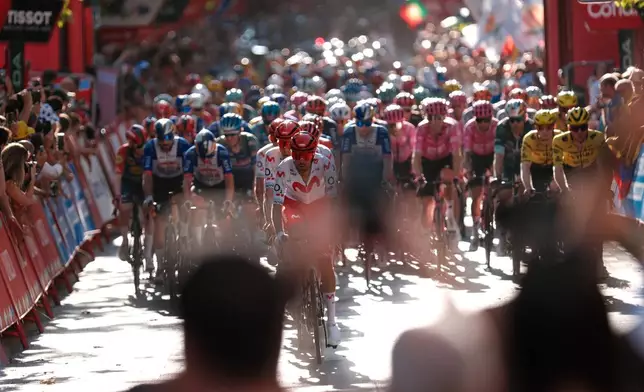 Cyclists ride during the 21st stage of the Spanish Vuelta cycling race, from Carrefour Granada to Granada, Spain, Sunday, Sept. 13, 2026. (AP Photo/Gregorio Marrero)