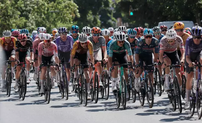 Cyclists ride during the 19th stage of the Spanish Vuelta cycling race, from Vélez-Málaga to Peñas Blancas in Estepona, Spain, Friday, Sept. 11, 2026. (AP Photo/Gregorio Marrero)