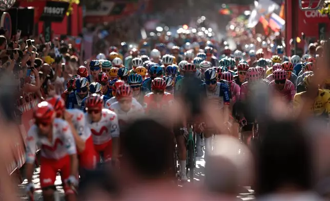 Cyclists ride during the 21st stage of the Spanish Vuelta cycling race, from Carrefour Granada to Granada, Spain, Sunday, Sept. 13, 2026. (AP Photo/Gregorio Marrero)