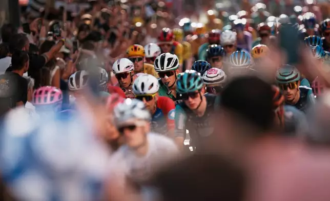Cyclists ride during the 21st stage of the Spanish Vuelta cycling race, from Carrefour Granada to Granada, Spain, Sunday, Sept. 13, 2026. (AP Photo/Gregorio Marrero)