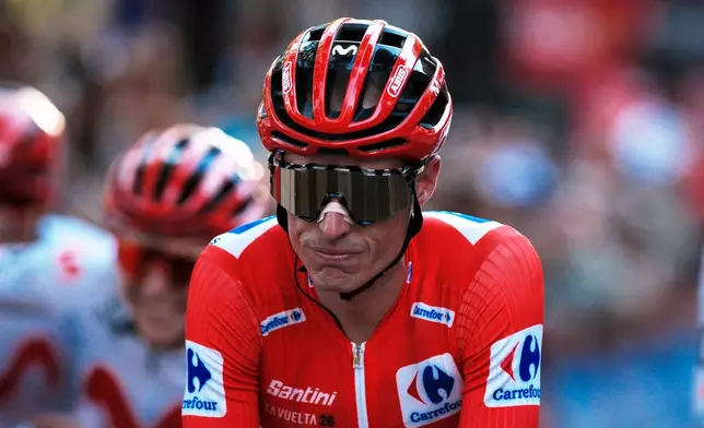 Spain's Enric Mas crosses the finish line during the 21st stage of the Spanish Vuelta cycling race, from Carrefour Granada to Granada, Spain, Sunday, Sept. 13, 2026. (AP Photo/Gregorio Marrero)