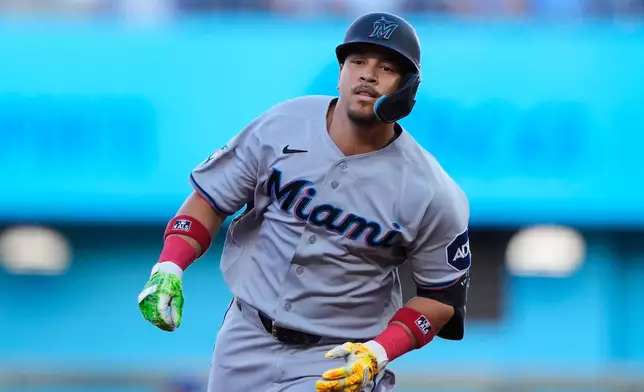 Miami Marlins' Heriberto Hernandez celebrates as he runs the bases after hitting a solo home run during the first inning of a baseball game against the Kansas City Royals, Thursday, Sept. 3, 2026, in Kansas City, Mo. (AP Photo/Charlie Riedel)