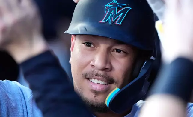 Miami Marlins' Heriberto Hernandez celebrates in the dugout after hitting a solo home run during the first inning of a baseball game against the Kansas City Royals, Thursday, Sept. 3, 2026, in Kansas City, Mo. (AP Photo/Charlie Riedel)