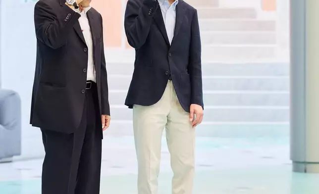 In this photo provided by the Imperial Household Agency of Japan, Japan's Prince Hisahito, right, visits the Science Museum of Map and Survey in Tsukuba, Ibaraki prefecture, Japan, on Aug. 13, 2026, ahead of his 20th birthday on Sept. 6, 2026. (The Imperial Household Agency of Japan via AP)
