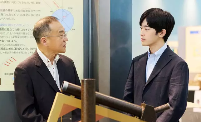 In this photo provided by the Imperial Household Agency of Japan, Japan's Prince Hisahito, right, visits the Science Museum of Map and Survey in Tsukuba, Ibaraki prefecture, Japan, on Aug. 13, 2026, ahead of his 20th birthday on Sept. 6, 2026. (The Imperial Household Agency of Japan via AP)