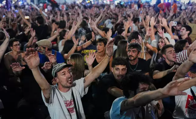People gather during a protest following the eviction last Wednesday of 87-year-old Maricarmen to demand stronger laws to protect renters at Sol square in Madrid, Spain, Saturday, Sept. 26, 2026. (AP Photo/Manu Fernandez)