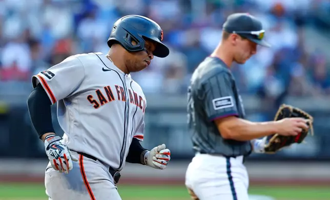 San Francisco Giants' Rafael Devers runs the bases after hitting a home run against the New York Mets during the fifth inning of a baseball game, Saturday, Sept. 5, 2026, in New York. (AP Photo/Noah K. Murray)