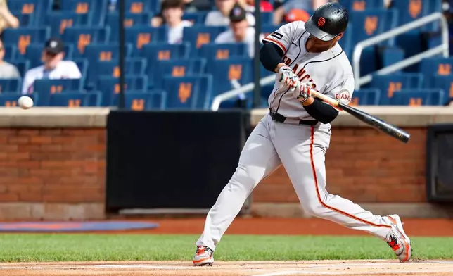 San Francisco Giants' Rafael Devers hits a home run against the New York Mets during the first inning of a baseball game, Saturday, Sept. 5, 2026, in New York. (AP Photo/Noah K. Murray)