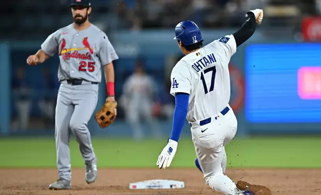 Los Angeles Dodgers' Shohei Ohtani (17) steals second base during the second inning of a baseball game against the St. Louis Cardinals, Wednesday, Sept. 2, 2026, in Los Angeles. (AP Photo/William Liang)
