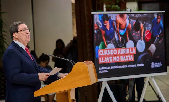 Foreign Minister Bruno Eduardo Rodríguez Parrilla, left, speaks to the press and presents Cuba's report on the impact of the US embargo policy on the island in Havana, Cuba, Monday, Sept. 7, 2026. (AP Photo/Ramon Espinosa)