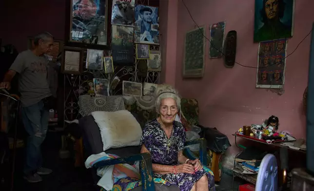 Teresita del Rosario González Ricardo poses for a photo, accompanied by her son José Manuel Borroto, at her home in Havana, Cuba, Sunday, Sept. 6, 2026. (AP Photo/Ramon Espinosa)
