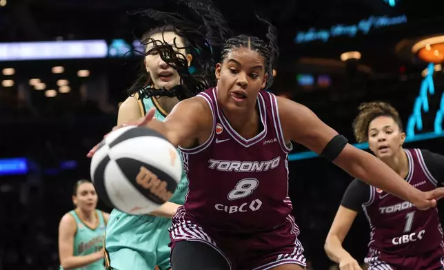FILE - Toronto Tempo forward Nyara Sabally (8) reaches for the ball during the second half of a WNBA basketball game against the New York Liberty, Wednesday, June 3, 2026, in New York. (AP Photo/Heather Khalifa, File)