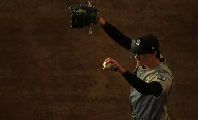 New York Yankees starting pitcher Max Fried stretches before a baseball game against the Minnesota Twins Tuesday, Sept. 15, 2026, in Minneapolis. (AP Photo/Abbie Parr)