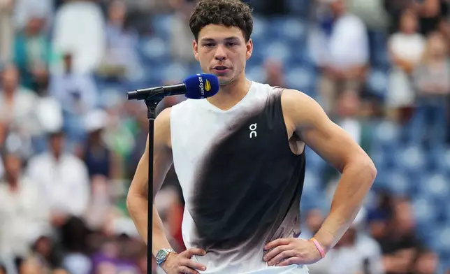 Ben Shelton, of the United States, speaks after he lost the men's singles final of the U.S. Open tennis championships against Alexander Zverev, of Germany, Sunday, Sept. 13, 2026, in New York. (AP Photo/Kirsty Wigglesworth)