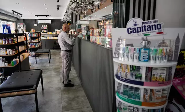 A man receives his medicine in a pharmacy in Tehran, Iran, Saturday, Aug. 29, 2026.(AP Photo/Vahid Salemi)