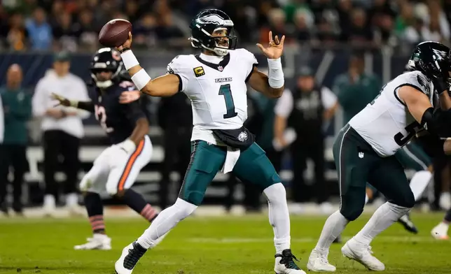 Philadelphia Eagles quarterback Jalen Hurts throws a pass during the first half of an NFL football game against the Chicago Bears in Chicago, Monday, Sept. 28, 2026. (AP Photo/Nam Y. Huh)