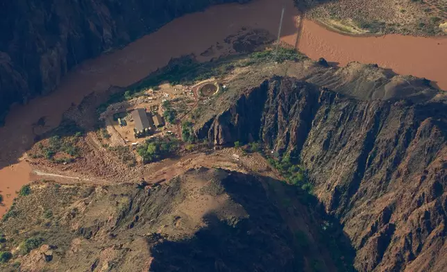 Flood debris lines Bright Angel Canyon near where it meets the Colorado River in the Grand Canyon, Monday, Aug. 31, 2026, at Grand Canyon National Park, Ariz. (AP Photo/John Locher)