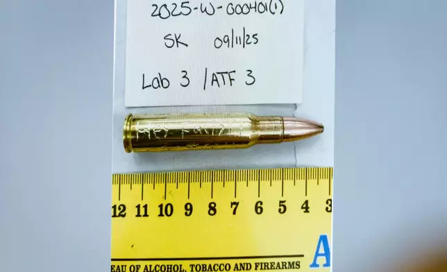 FILE - An image of a bullet casing engraved with the words, "Hey Fascist!" is displayed during a preliminary hearing for Tyler Robinson, who is accused in the fatal shooting of Charlie Kirk, at the Fourth District Courthouse in Provo, Utah, July 9, 2026. (AP Photo/Spenser Heaps, Pool, File)
