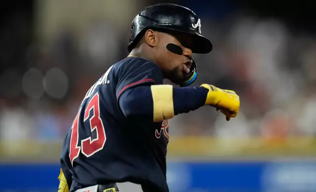 Atlanta Braves' Ronald Acuña Jr. celebrates as he runs the bases after hitting a grand slam during the seventh inning of a baseball game against the Houston Astros in Houston, Saturday, Sept. 19, 2026. (AP Photo/Ashley Landis)