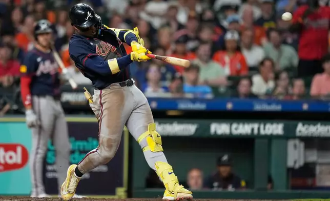 Atlanta Braves' Ronald Acuña Jr. hits a grand slam during the seventh inning of a baseball game against the Houston Astros in Houston, Saturday, Sept. 19, 2026. (AP Photo/Ashley Landis)