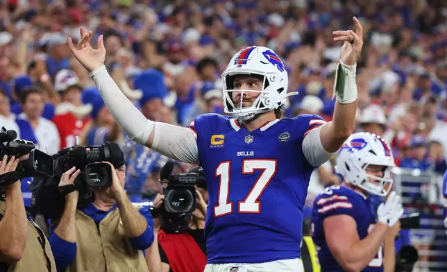 Buffalo Bills quarterback Josh Allen (17) celebrates his rushing touchdown against the Detroit Lions during the second half of an NFL football game in Orchard Park, N.Y., Thursday, Sept. 17, 2026. (AP Photo/Jeffrey T. Barnes )