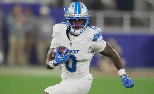 Detroit Lions running back Jahmyr Gibbs (0) runs the ball against the Buffalo Bills during the first half of an NFL football game in Orchard Park, N.Y., Thursday, Sept. 17, 2026. (AP Photo/Sue Ogrocki)