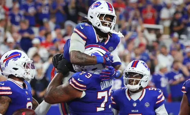 Buffalo Bills running back James Cook (4) celebrates his rushing touchdown against the Detroit Lions during the second half of an NFL football game in Orchard Park, N.Y., Thursday, Sept. 17, 2026. (AP Photo/Jeffrey T. Barnes )