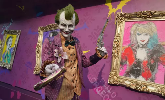 A man dressed as The Joker poses for a photograph during Batman day in Beijing, Saturday, Sept. 19, 2026. (AP Photo/Achmad Ibrahim)