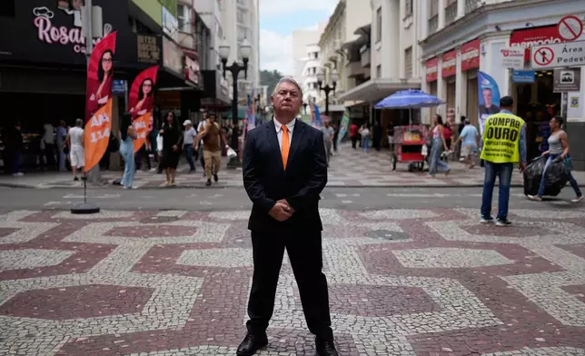 Plinio Vicentin Jr., who is running for federal lawmaker as "Plinio Trump," with the Novo Party representing Minas Gerais state, poses for a portrait as he campaigns ahead of the general election in Juiz de Fora, Minas Gerais state, Brazil, Monday, Sept. 28, 2026. (AP Photo/Silvia Izquierdo)