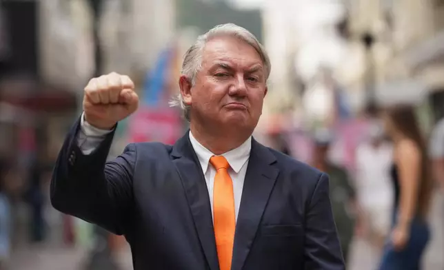 Plinio Vicentin Jr., who is running for federal lawmaker as "Plinio Trump," with the Novo Party representing Minas Gerais state, poses for a photo a he campaigns ahead of the general election in Juiz de Fora, Minas Gerais state, Brazil, Monday, Sept. 28, 2026. (AP Photo/Silvia Izquierdo)