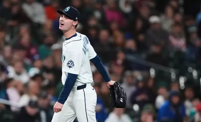 Seattle Mariners starting pitcher Kade Anderson reacts after being hit by a line drive single by Los Angeles Angels' Christian Moore during the fourth inning of a baseball game, Saturday, Sept. 26, 2026, in Seattle. (AP Photo/Lindsey Wasson)