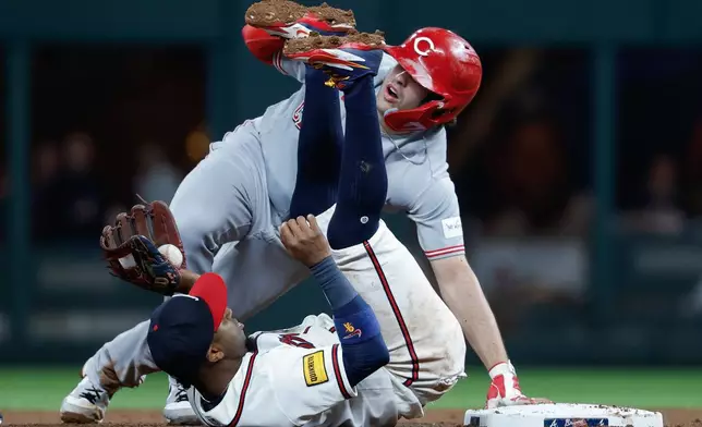 Cincinnati Reds' Sal Stewart (27) is caught stealing by Atlanta Braves second baseman Ozzie Albies during the fifth inning of a baseball game, Thursday, Sept. 24, 2026, in Atlanta. (AP Photo/Erik S. Lesser)