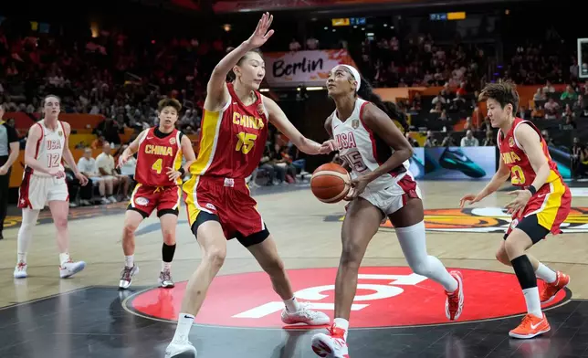China's Han Xu guards United States' Angel Reese during the Women's Basketball World Cup match between China and the United States in Berlin, Friday, Sept. 4, 2026. (AP Photo/Ebrahim Noroozi)