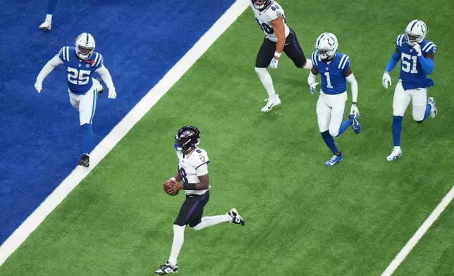 Baltimore Ravens' Lamar Jackson runs for a touchdown during the first half of an NFL football game against the Indianapolis Colts Sunday, Sept. 13, 2026, in Indianapolis. (AP Photo/AJ Mast)