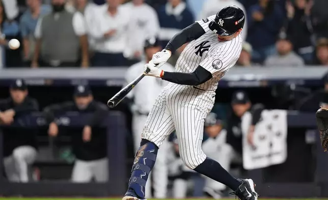 New York Yankees' Ben Rice connects for a grand slam off Boston Red Sox pitcher Brayan Bello during the eighth inning in Game 1 of baseball's American League Wild Card Series, Tuesday, Sept. 29, 2026, in New York. (AP Photo/Frank Franklin II)