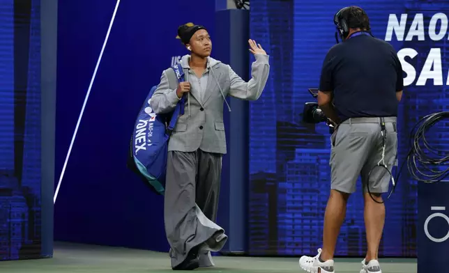 Naomi Osaka, of Japan, arrives for her match against Elise Mertens, of Belgium, in the third round of the U.S. Open tennis championships, Saturday, Sept. 5, 2026, in New York. (AP Photo/Adam Hunger)