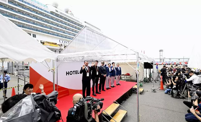 The ceremony for the Italian cruise ship, the Costa Serena, that will house up to 5,000 officials and athletes for the Asian Games, seen at background, is held upon the arrival at a port in Nagoya, central Japan, Tuesday, Sept. 15, 2026. (Kazushi Kurihara/Kyodo News via AP)