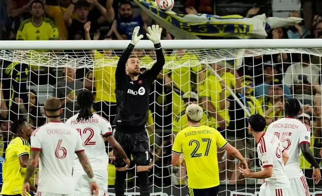 Toronto FC goalkeeper Luka Gavran (1) leaps for the ball during the first half of an MLS soccer match against Nashville SC, Saturday, Sept. 26, 2026, in Nashville, Tenn. (AP Photo/George Walker IV)