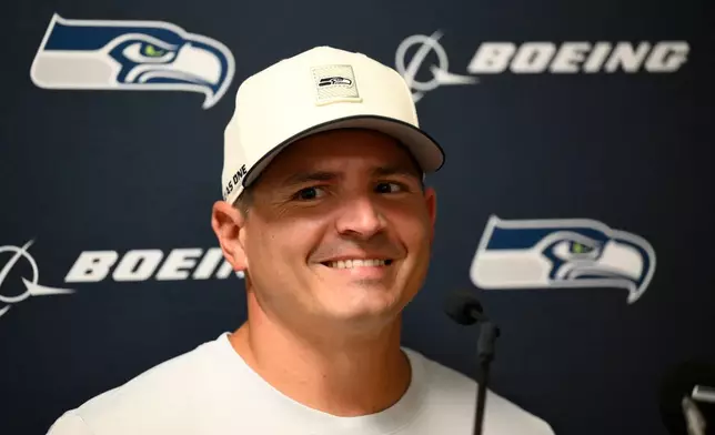 Seattle Seahawks head coach Mike MacDonald listens to a question during a news conference after a preseason NFL football game against the Kansas City Chiefs, Friday, Aug. 28, 2026, in Kansas City, Mo. (AP Photo/Reed Hoffmann)