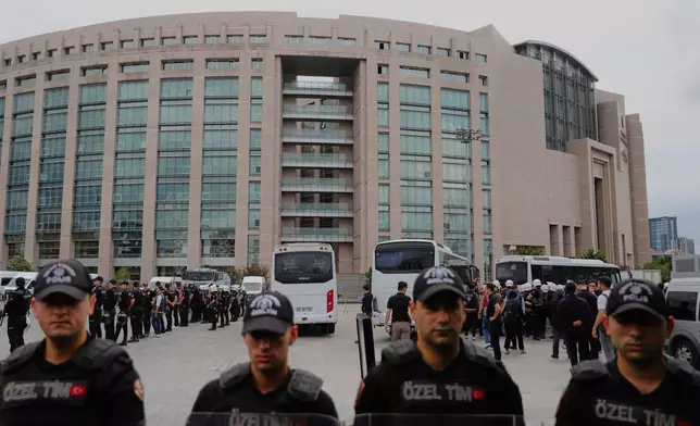 Turkish police stand guard outside a courthouse after preventing LGBTQ+ rights supporters from holding a news conference in Istanbul, Turkey, Tuesday, Sept. 15, 2026. (AP Photo/Dilara Acikgoz)