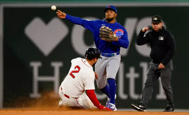 Boston Red Sox's Isiah Kiner-Falefa (2) is out at second as Chicago Cubs' Pedro Ramirez, top left, throws to first base for a double play during the fifth inning of the second baseball game of a doubleheader, Friday, Sept. 25, 2026, in Boston. (AP Photo/Greg M. Cooper)