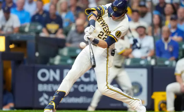 Milwaukee Brewers designated hitter Christian Yelich hits a three-run home run during the first inning of a baseball game against the Chicago Cubs Wednesday, Sept. 9, 2026, in Milwaukee. (AP Photo/Kayla Wolf)